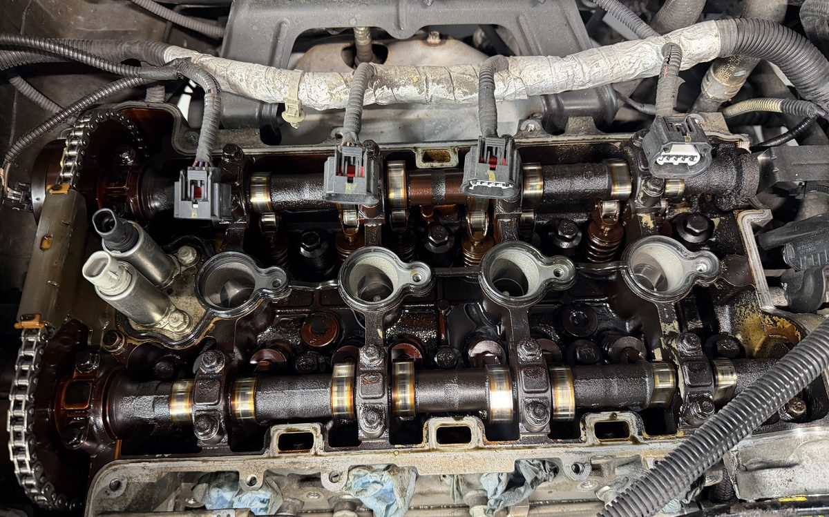 Engine valve train and camshafts exposed during diagnostics at America Auto Repair in Doral, FL
